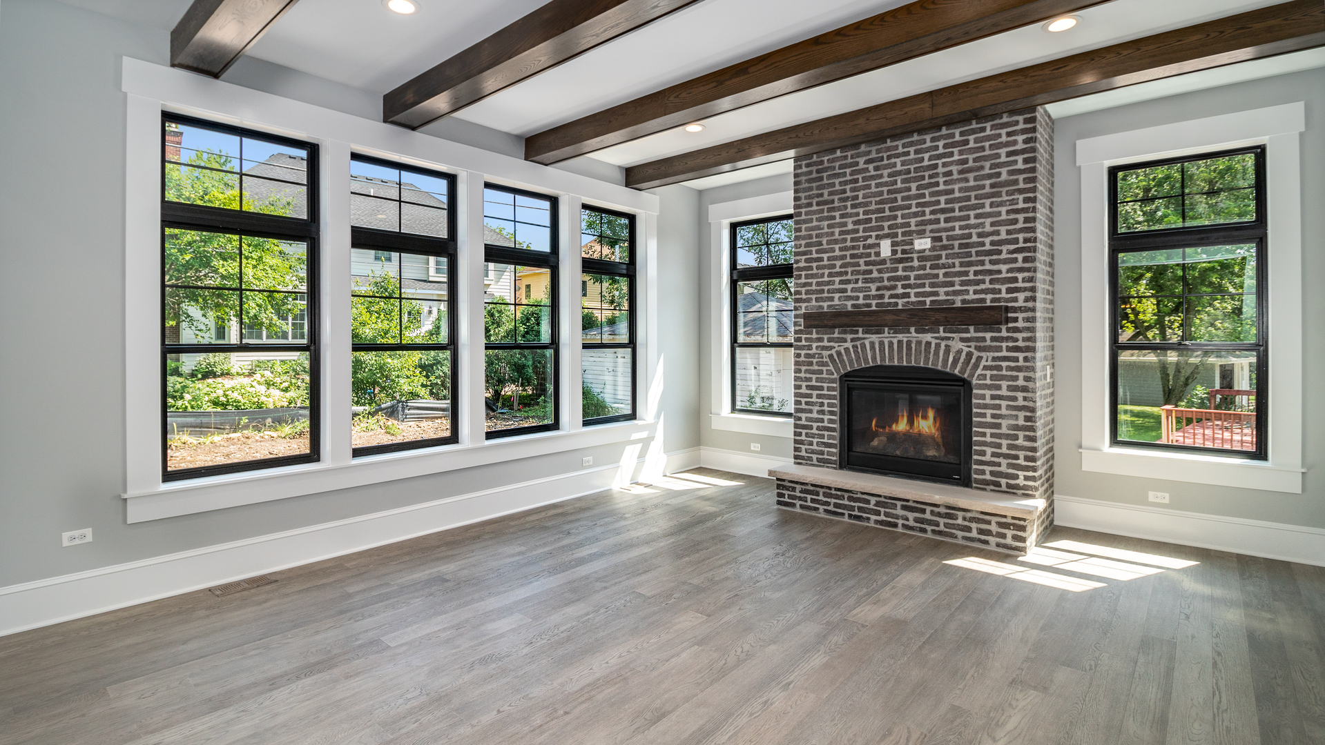635 North Main Street Naperville, IL 60563 - Photo 15 of 26 a view of an empty room with wooden floor fireplace and a window