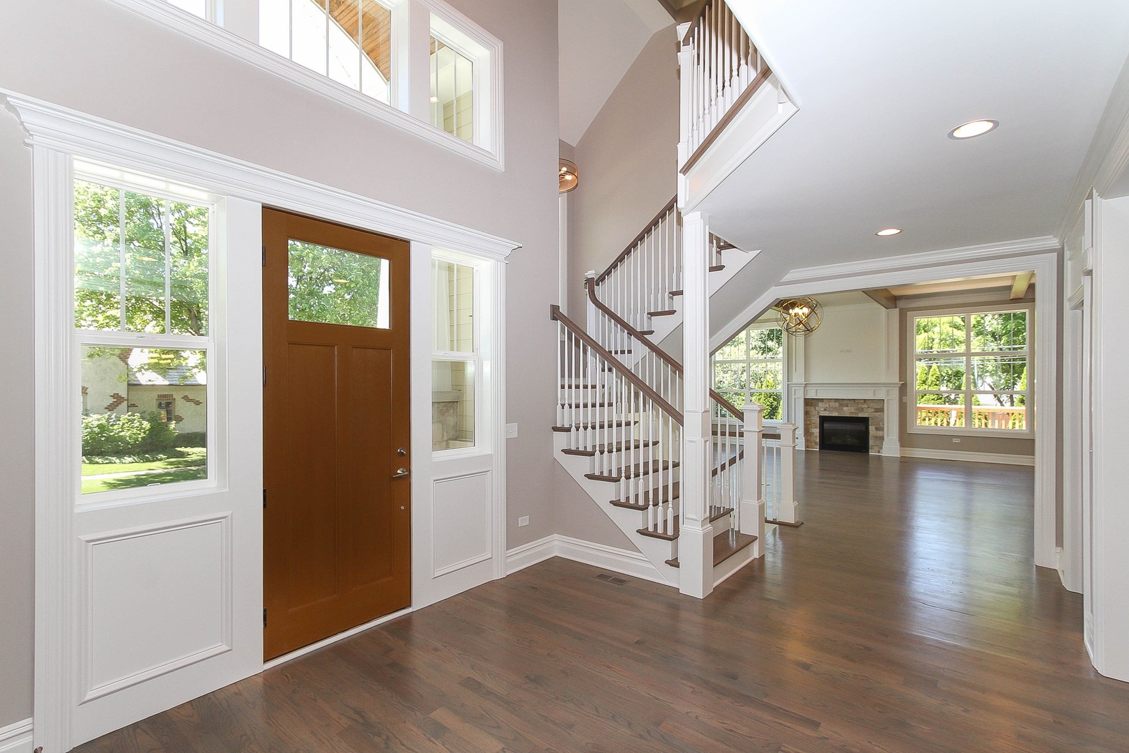 635 North Main Street Naperville, IL 60563 - Photo 16 of 26 an entryway in a hall with a window and wooden floor
