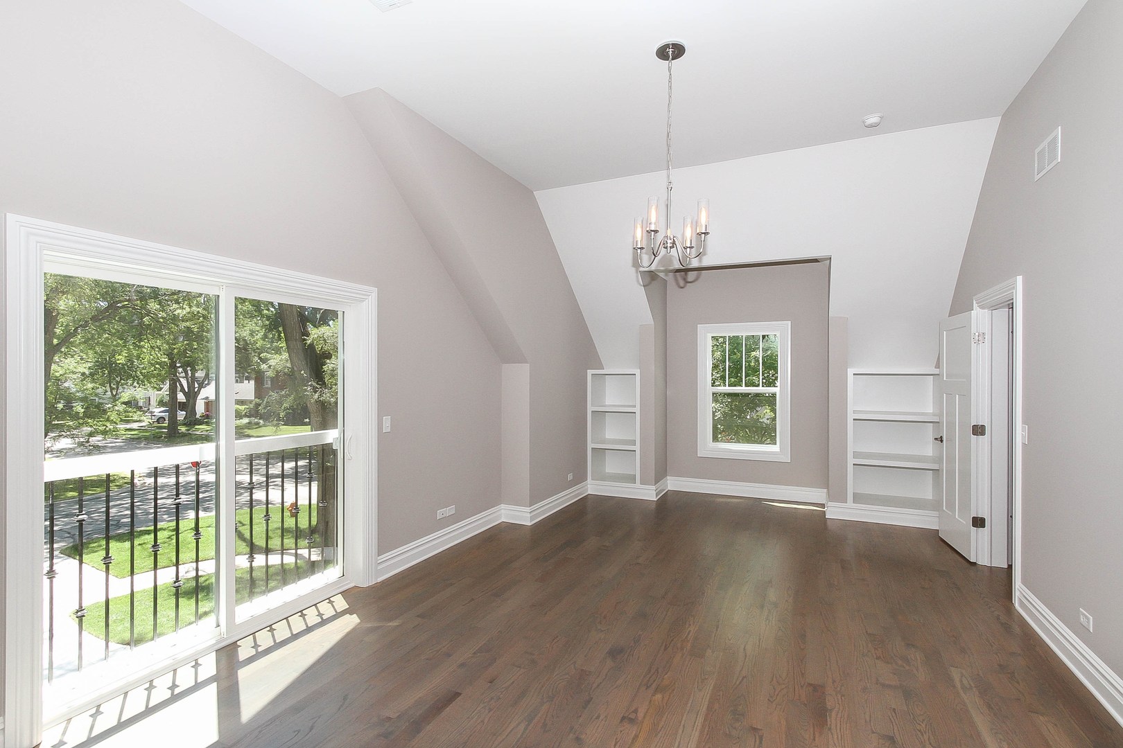 635 North Main Street Naperville, IL 60563 - Photo 19 of 26 a view of a room with wooden floor staircase and windows