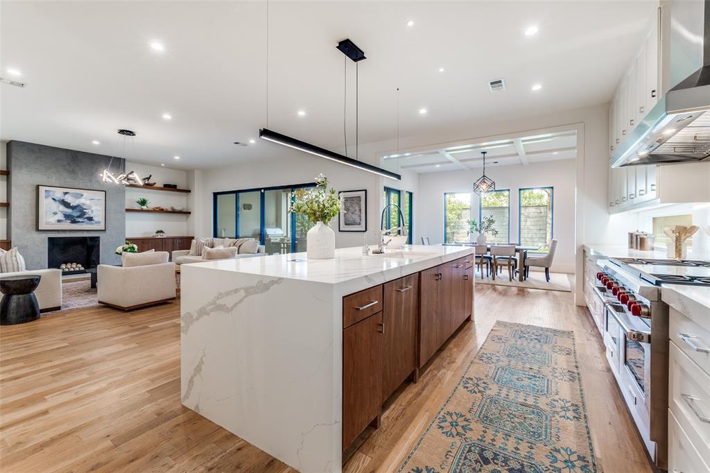 5111 West Amherst Avenue Dallas, TX 75209 - Photo 15 of 36 a large kitchen with stainless steel appliances kitchen island granite countertop a large counter top and stove