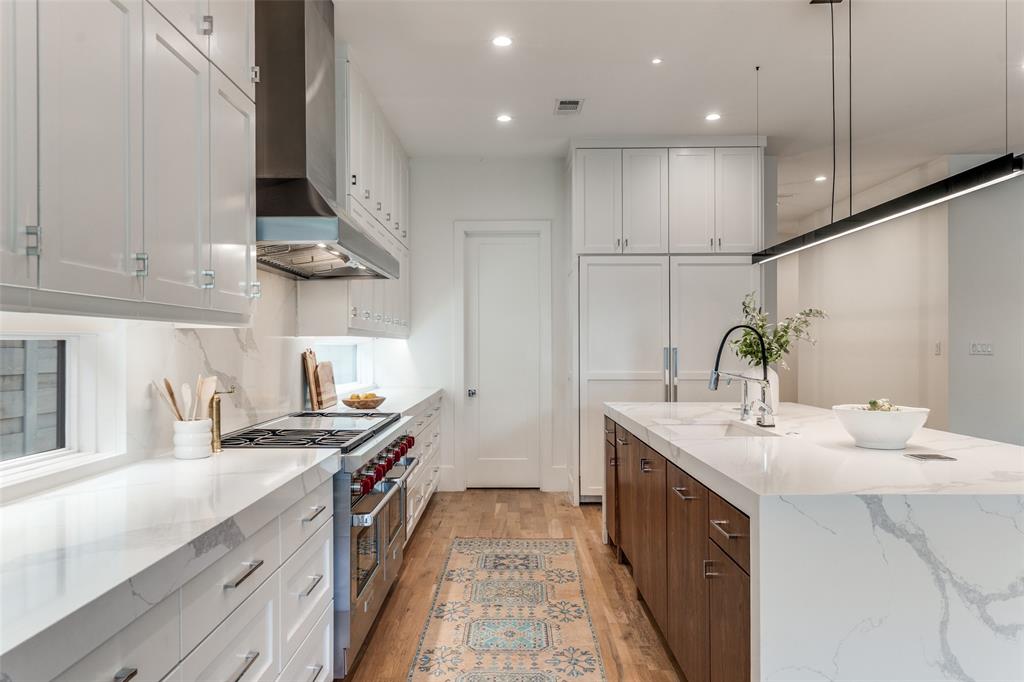5111 West Amherst Avenue Dallas, TX 75209 - Photo 17 of 36 a kitchen with a sink stove and cabinets