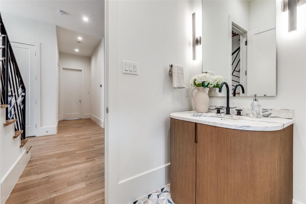5111 West Amherst Avenue Dallas, TX 75209 - Photo 21 of 36 a bathroom with a sink and a mirror