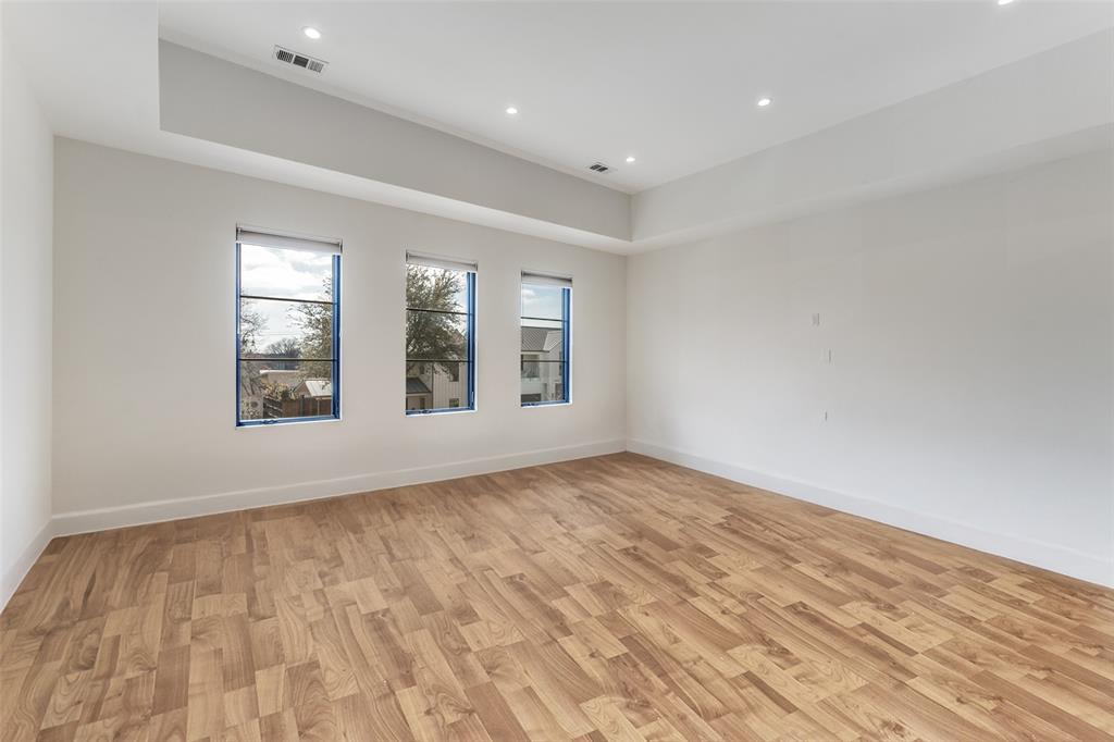 5111 West Amherst Avenue Dallas, TX 75209 - Photo 23 of 36 wooden floor in an empty room with a window