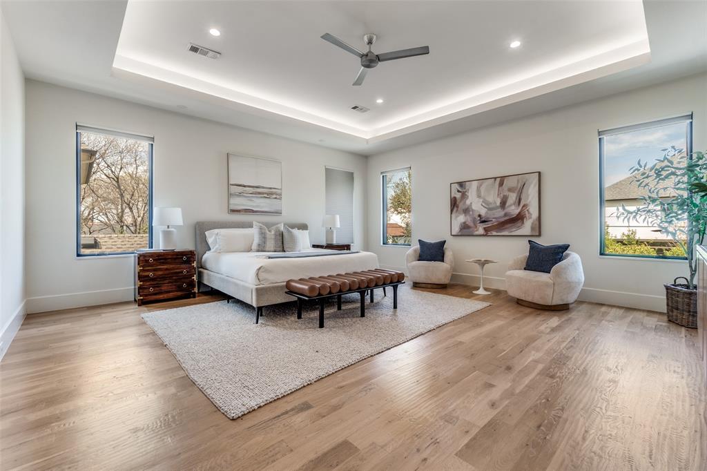 5111 West Amherst Avenue Dallas, TX 75209 - Photo 25 of 36 a bedroom room with furniture and a wooden floor