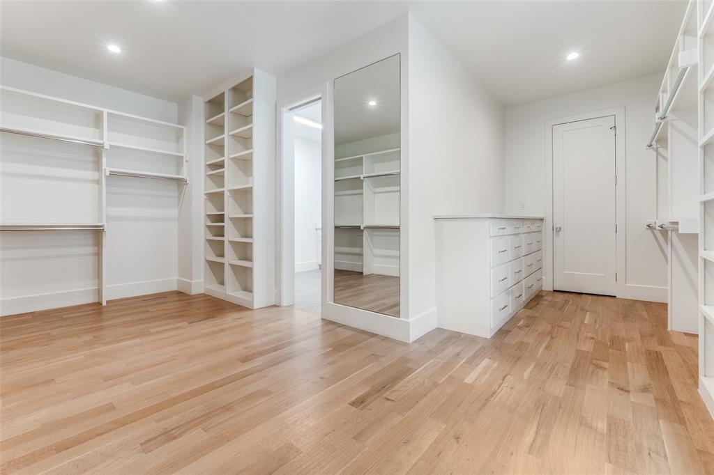 5111 West Amherst Avenue Dallas, TX 75209 - Photo 29 of 36 wooden floor in an empty room with a kitchen
