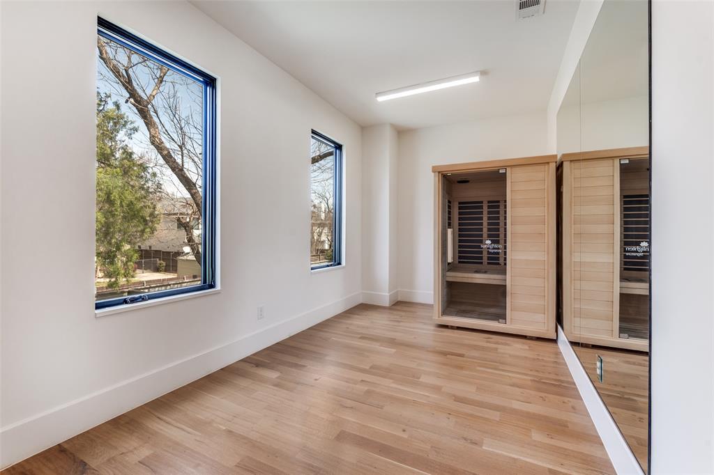 5111 West Amherst Avenue Dallas, TX 75209 - Photo 30 of 36 a view of an empty room with wooden floor and a window