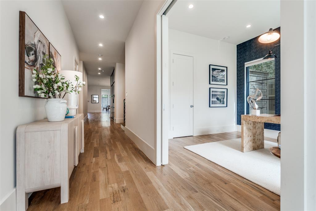 5111 West Amherst Avenue Dallas, TX 75209 - Photo 3 of 36 a view of a hallway with wooden floor and a living room