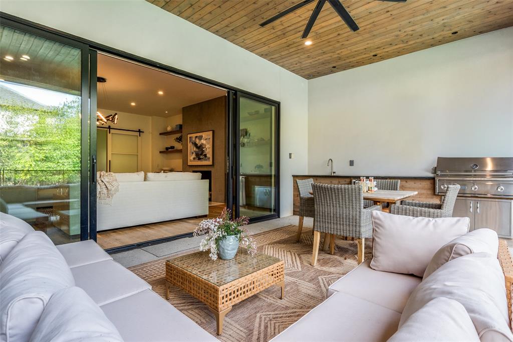 5111 West Amherst Avenue Dallas, TX 75209 - Photo 33 of 36 a living room with furniture and a chandelier