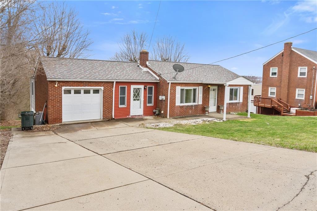 front view of a house with a yard