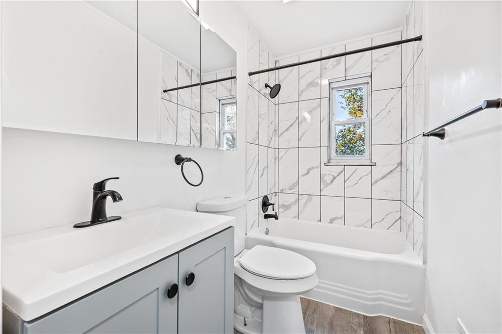 63 Herbst Road Coraopolis, PA 15108 - Photo 13 of 19 a bathroom with a sink toilet and shower