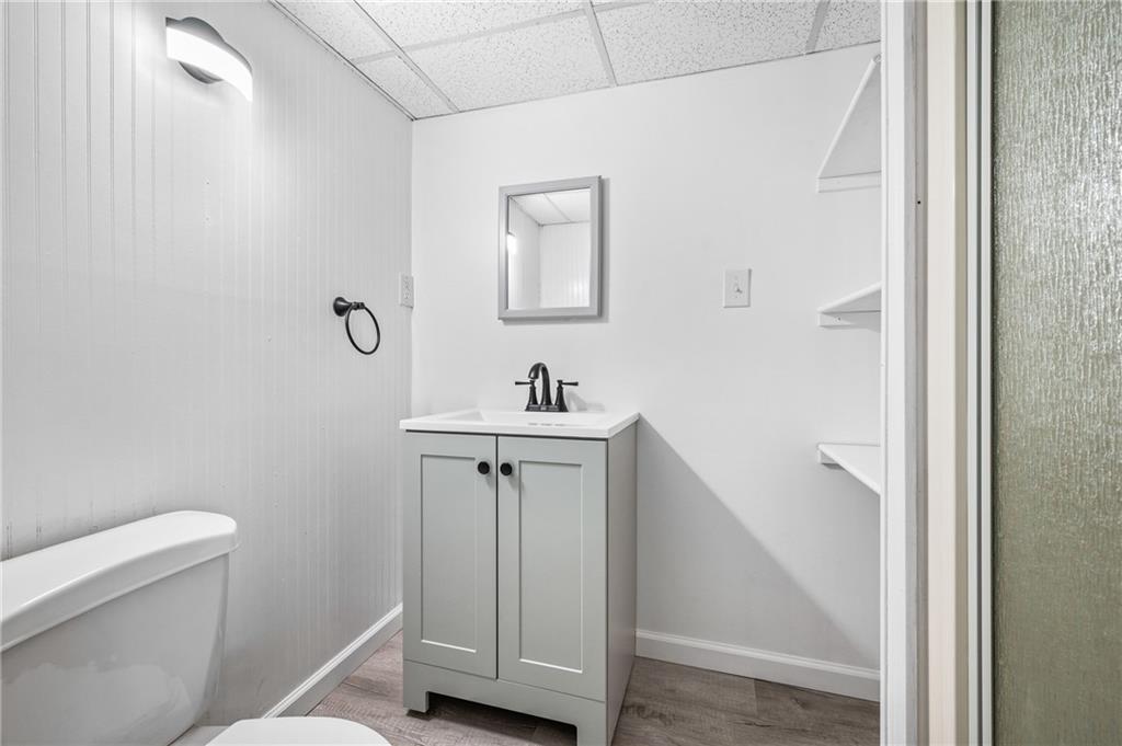63 Herbst Road Coraopolis, PA 15108 - Photo 15 of 19 a bathroom with a sink a toilet and a mirror