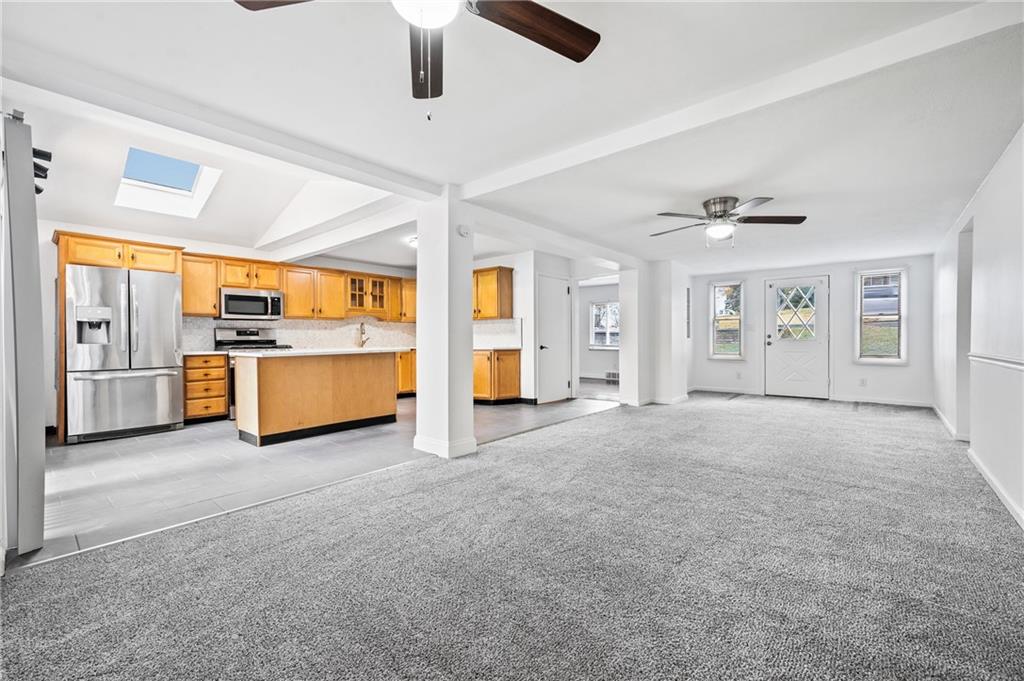 63 Herbst Road Coraopolis, PA 15108 - Photo 4 of 19 a view of an empty room with a kitchen