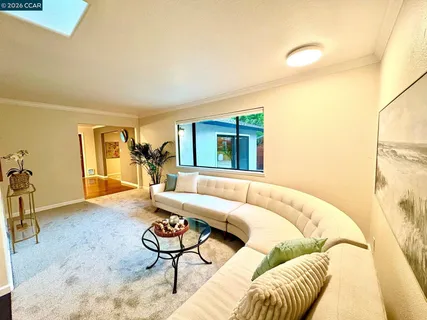 a living room with a couch and a table