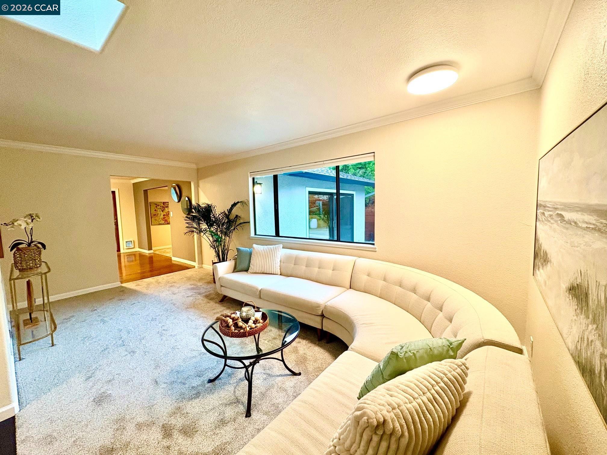 2589 Pebble Beach Loop Lafayette, CA 94549 - Photo 5 of 32 a living room with a couch and a table