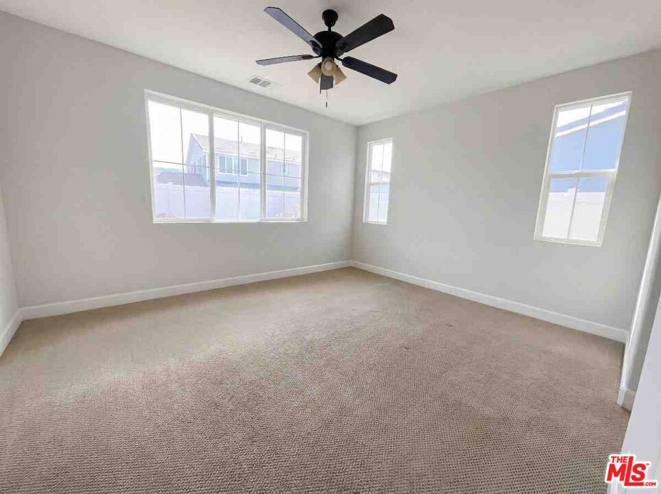264 Rose Street Fillmore, CA 93015 - Photo 16 of 24 a view of a livingroom with a ceiling fan and window