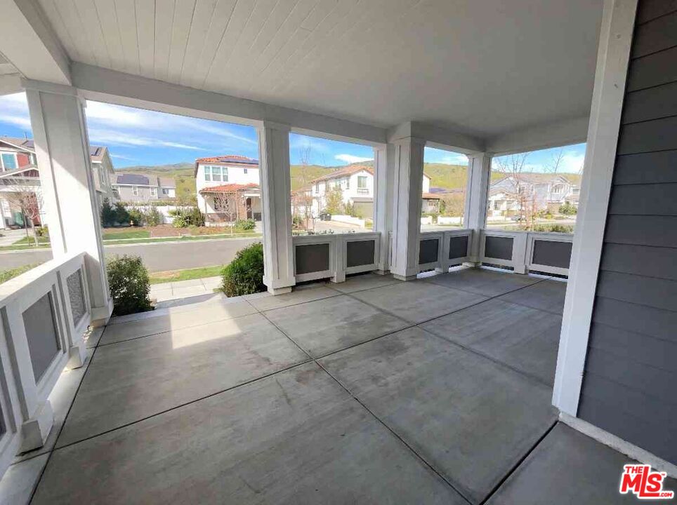 264 Rose Street Fillmore, CA 93015 - Photo 23 of 24 a view of a porch with furniture and floor to ceiling window