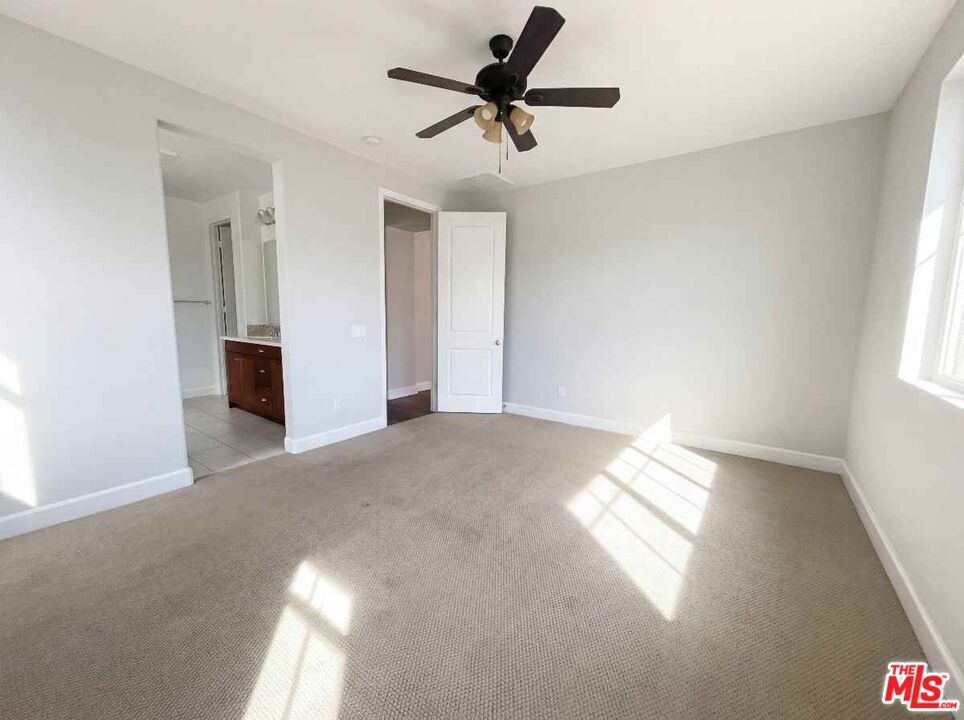 264 Rose Street Fillmore, CA 93015 - Photo 4 of 24 a view of a livingroom with a window and a ceiling fan
