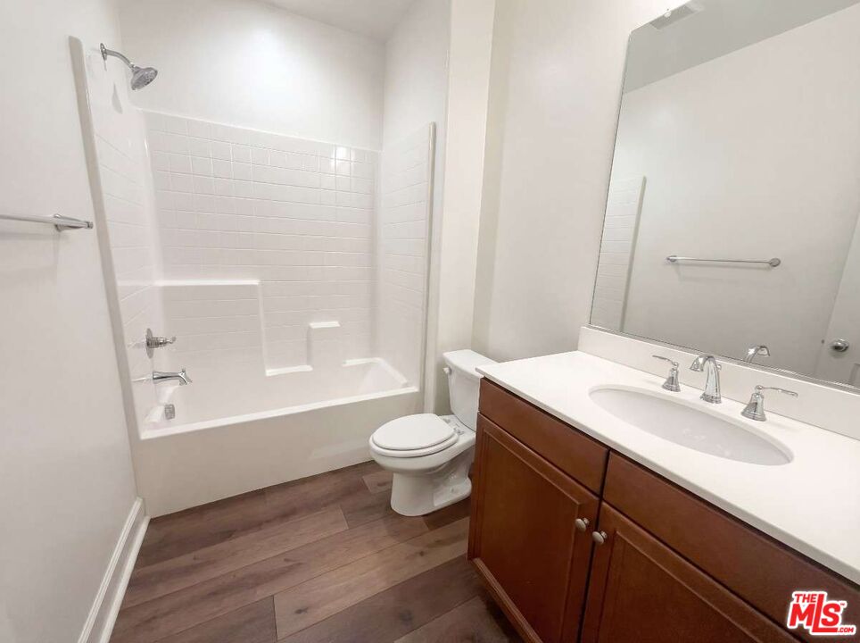 264 Rose Street Fillmore, CA 93015 - Photo 7 of 24 a bathroom with a sink a toilet a mirror and shower