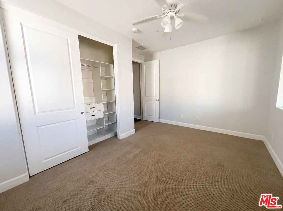 264 Rose Street Fillmore, CA 93015 - Photo 9 of 24 an empty room with closet and windows