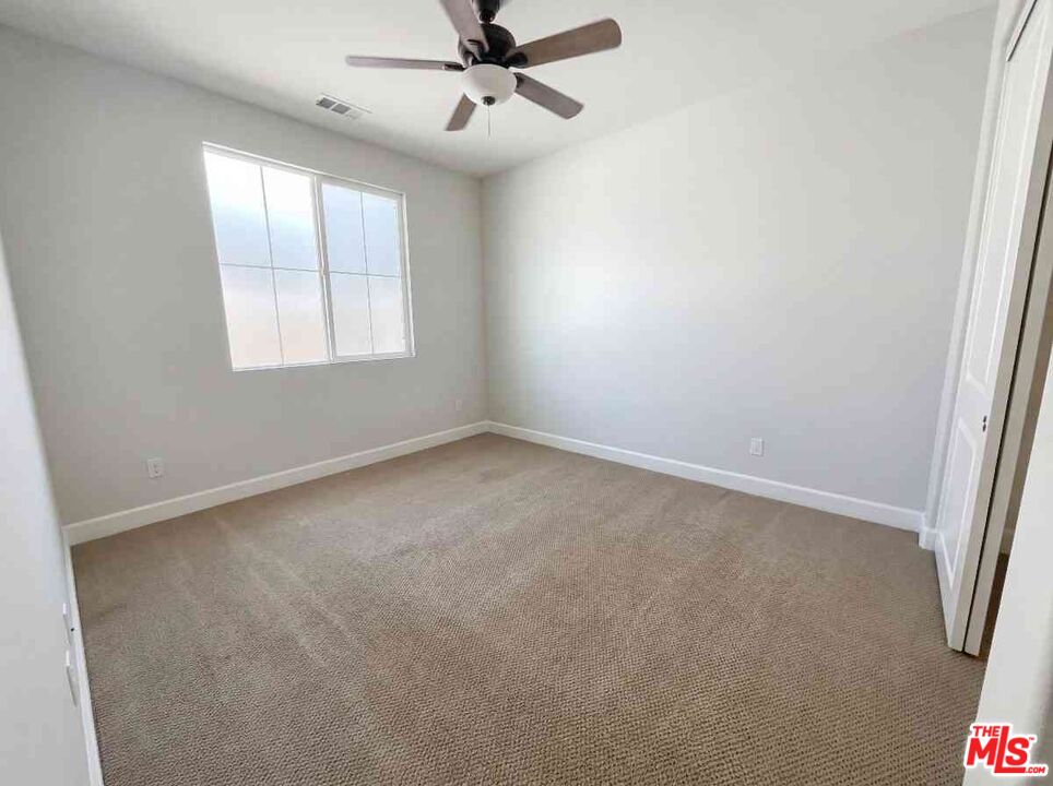 264 Rose Street Fillmore, CA 93015 - Photo 10 of 24 an empty room with windows and fan