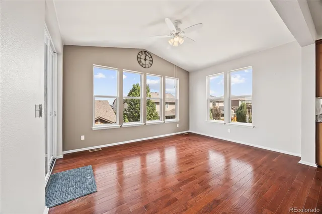 a bathroom with a granite countertop bathtub a sink and mirror