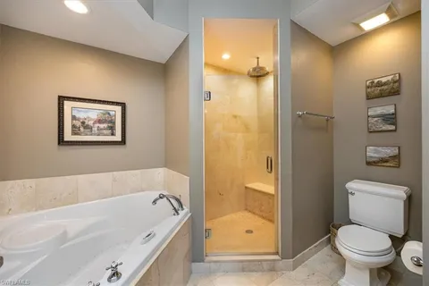 a bathroom with a bathtub and a toilet