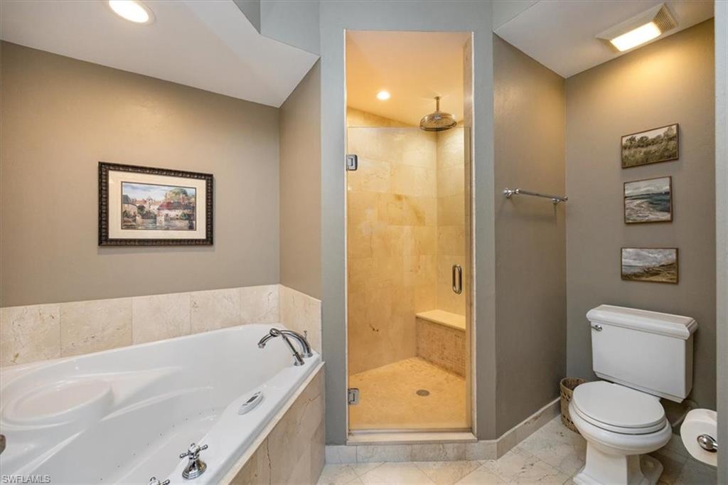410 Bayfront Place, Unit 2407 Naples, FL 34102 - Photo 13 of 30 a bathroom with a bathtub and a toilet