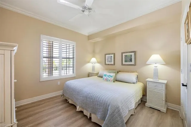 a bedroom with a bed and a lamp