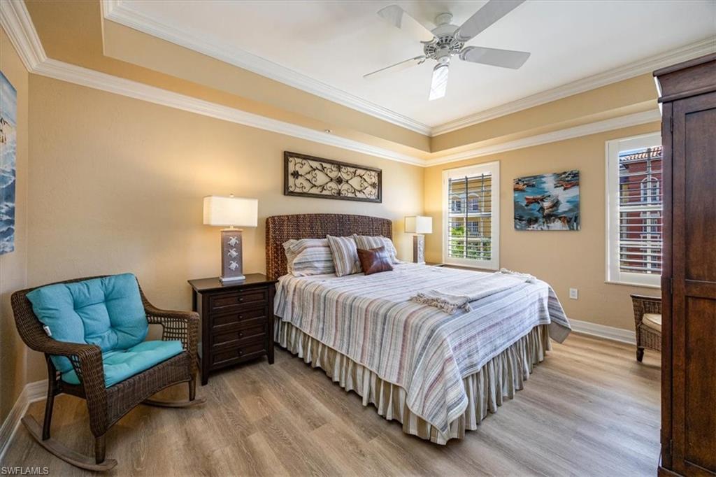 410 Bayfront Place, Unit 2407 Naples, FL 34102 - Photo 10 of 30 a bedroom with a bed and a couch