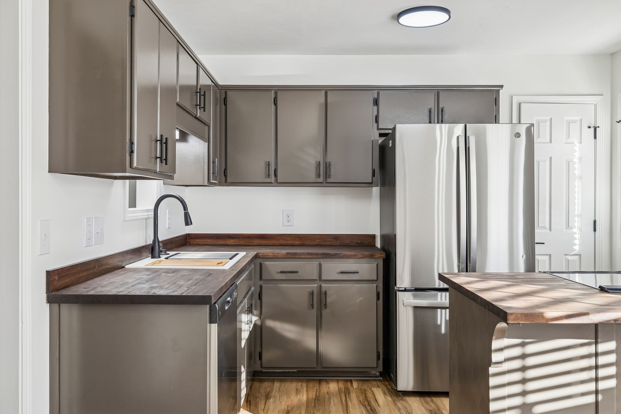 803 Pebble Point Mount Juliet, TN 37122 - Photo 12 of 39 a kitchen with stainless steel appliances granite countertop a refrigerator and a sink