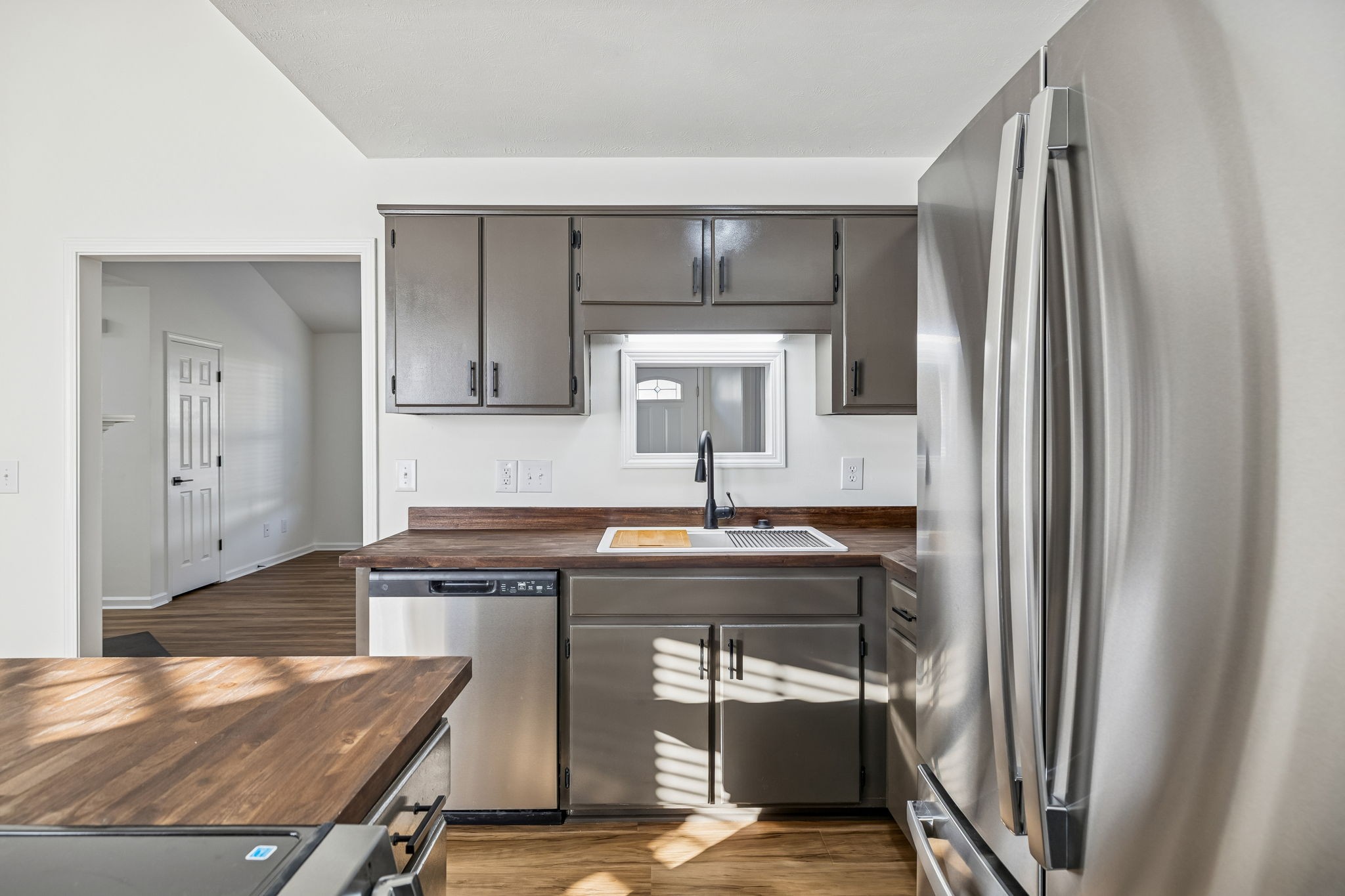 803 Pebble Point Mount Juliet, TN 37122 - Photo 15 of 39 a kitchen with kitchen island a sink stove and refrigerator