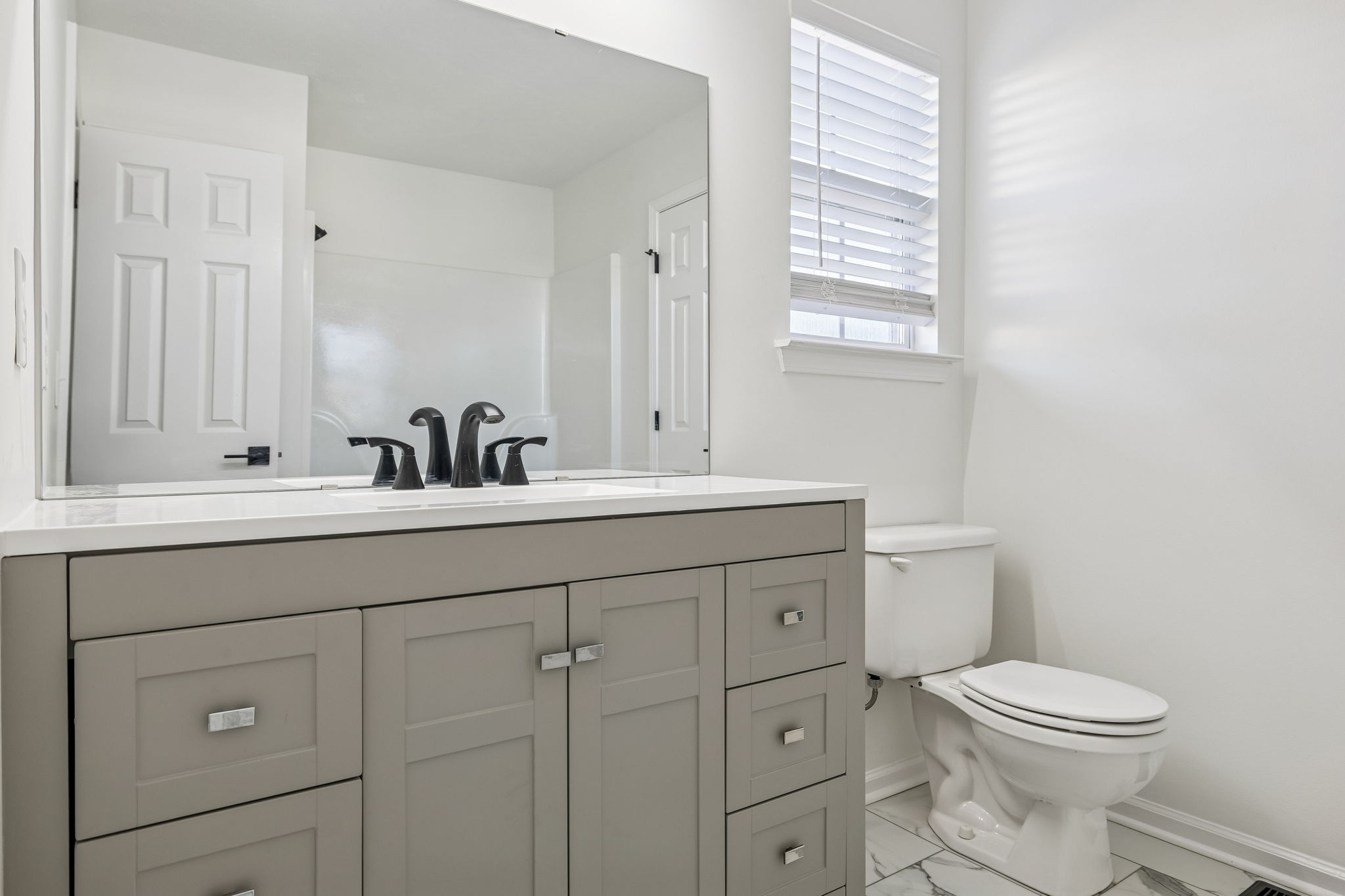 803 Pebble Point Mount Juliet, TN 37122 - Photo 21 of 39 a bathroom with a toilet a sink a mirror and a window