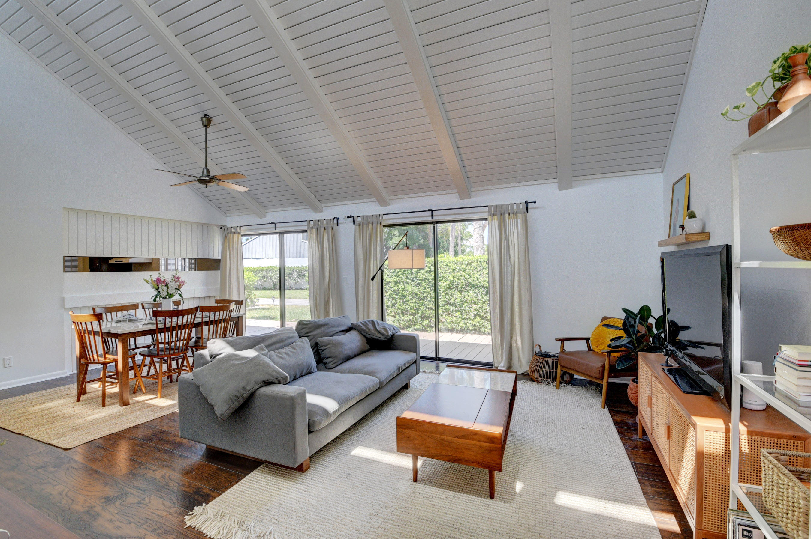 235 Northwest 15th Street Boca Raton, FL 33432 - Photo 1 of 32 a living room with furniture flat screen tv and a large window