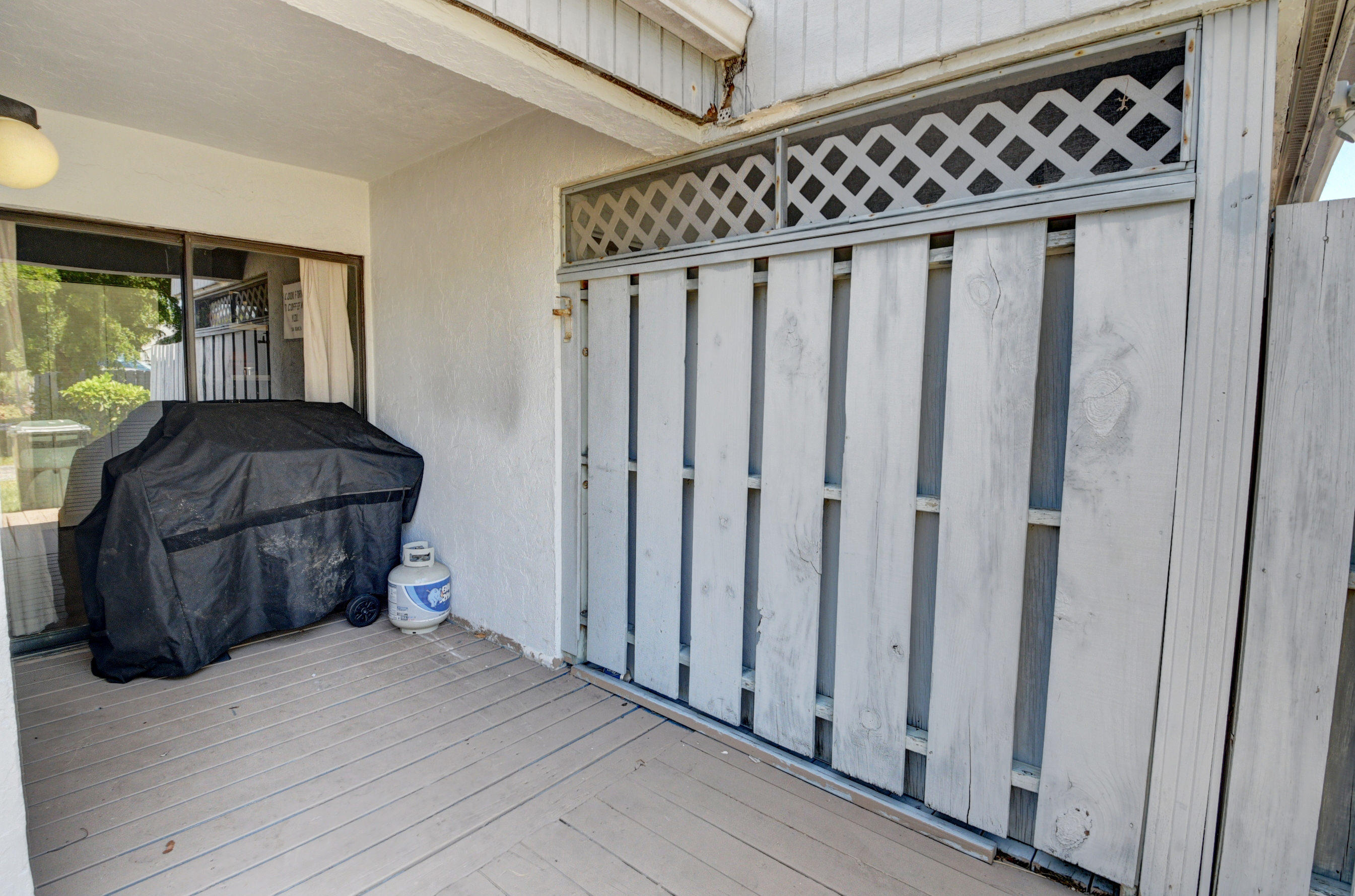 235 Northwest 15th Street Boca Raton, FL 33432 - Photo 27 of 32 a view of a porch with wooden floor