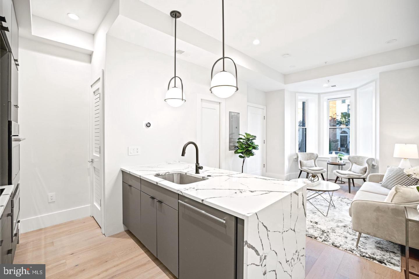 1128 6th Street Northwest, Unit 3 Washington, DC 20001 - Photo 12 of 26 a very nice looking room with a large window and chandelier