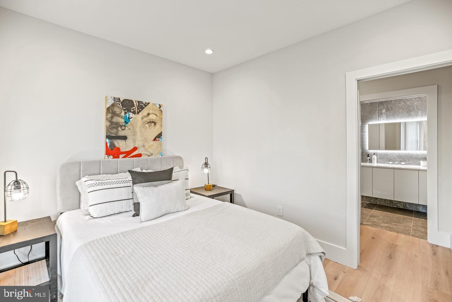 1128 6th Street Northwest, Unit 3 Washington, DC 20001 - Photo 16 of 26 a bedroom with a bed and a couch