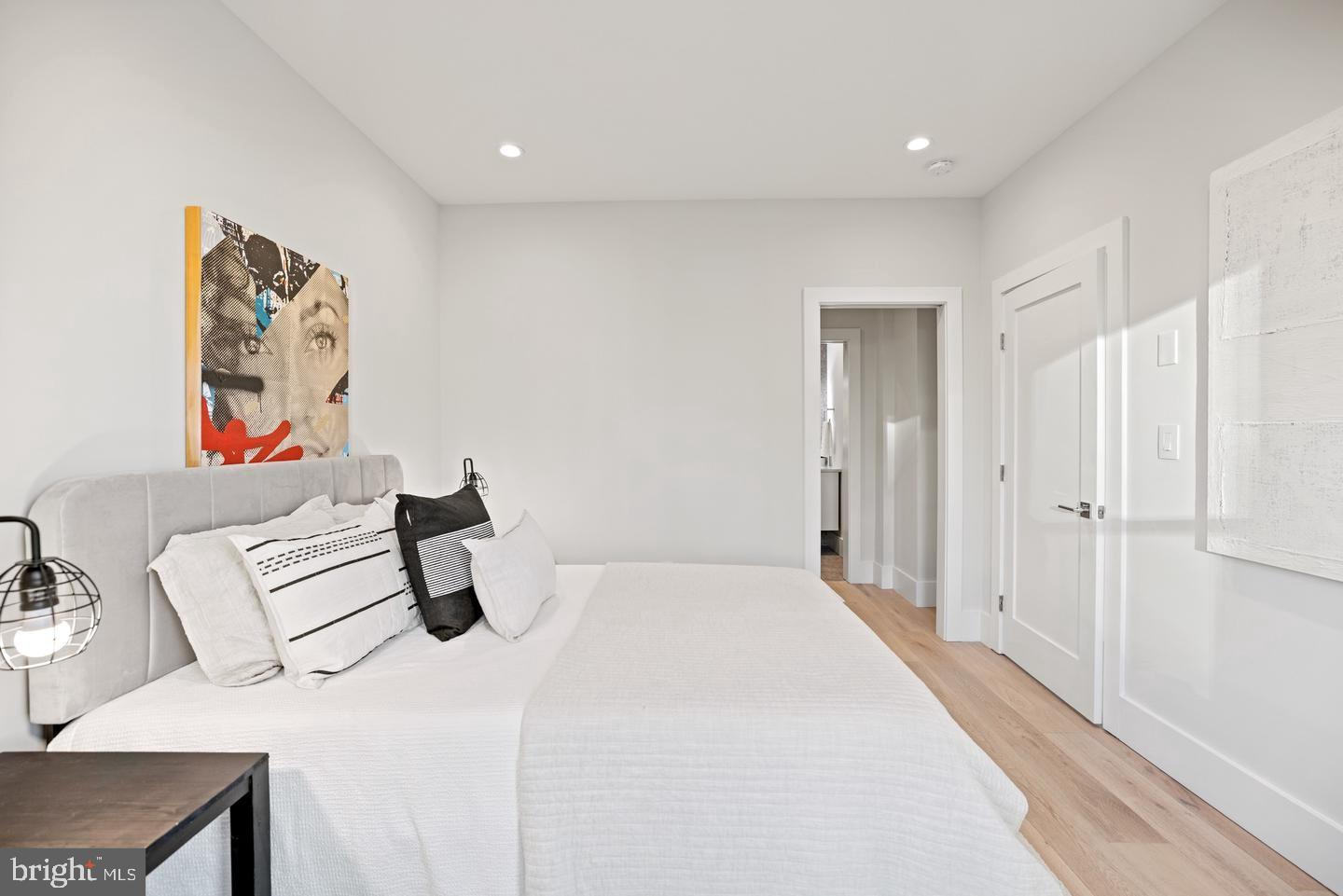 1128 6th Street Northwest, Unit 3 Washington, DC 20001 - Photo 17 of 26 a bedroom with a bed and a table