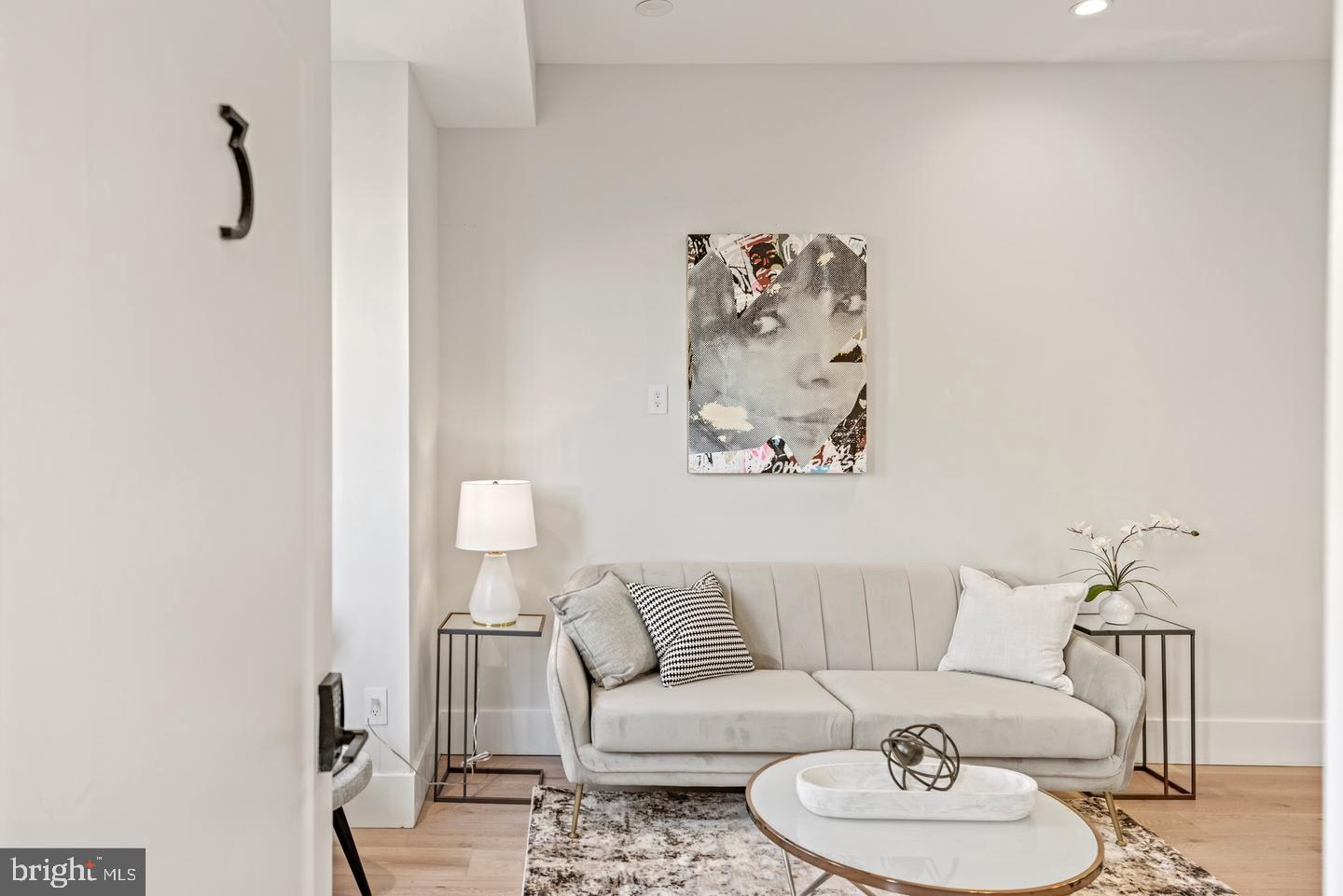 1128 6th Street Northwest, Unit 3 Washington, DC 20001 - Photo 24 of 26 a living room with furniture and a table