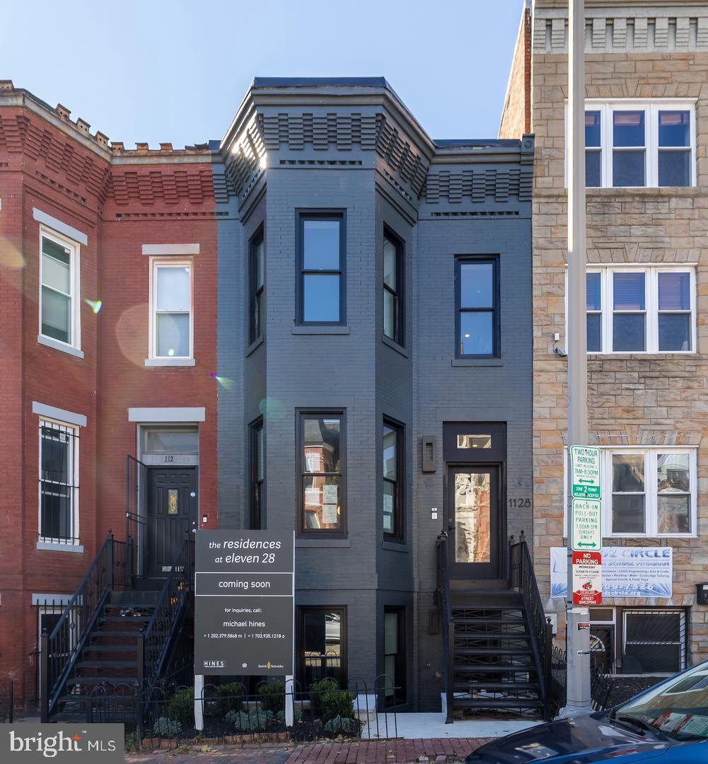 1128 6th Street Northwest, Unit 3 Washington, DC 20001 - Photo 3 of 26 a front view of a brick building with many windows
