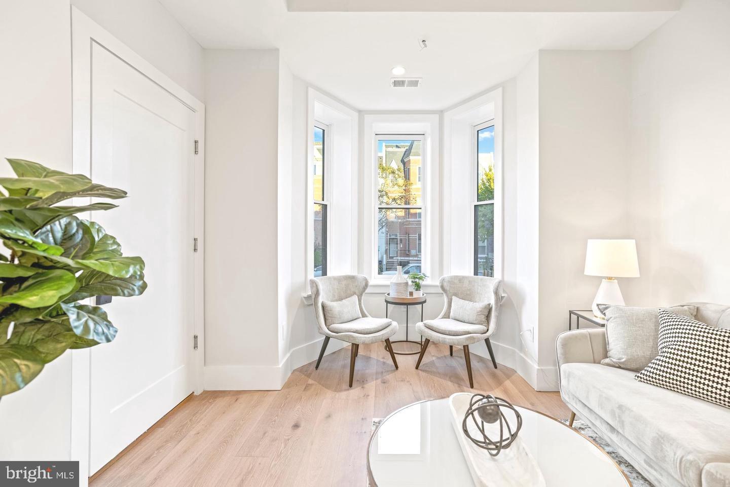 1128 6th Street Northwest, Unit 3 Washington, DC 20001 - Photo 6 of 26 a living room with furniture and a window