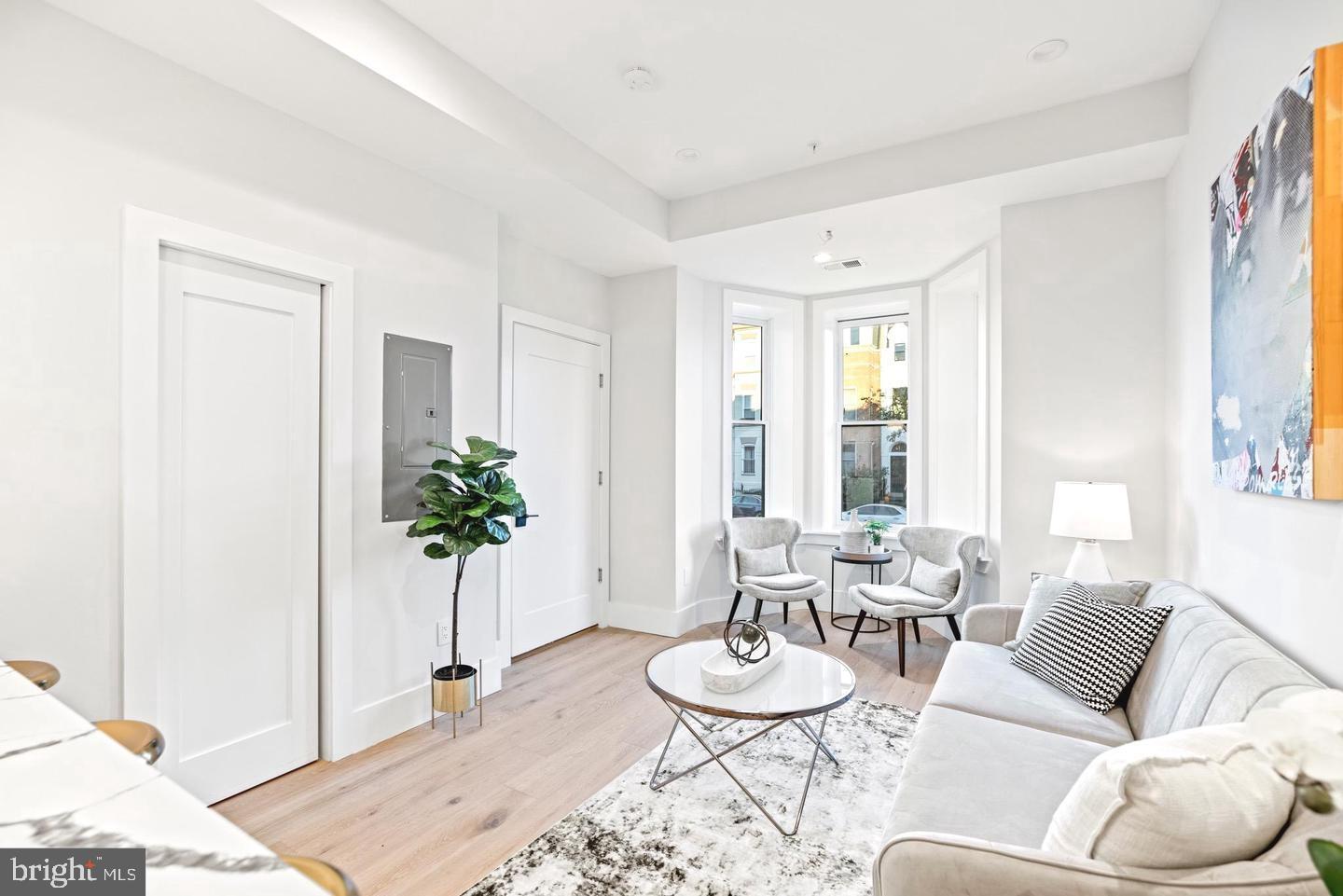 1128 6th Street Northwest, Unit 3 Washington, DC 20001 - Photo 10 of 26 a dining room with furniture and wooden floor
