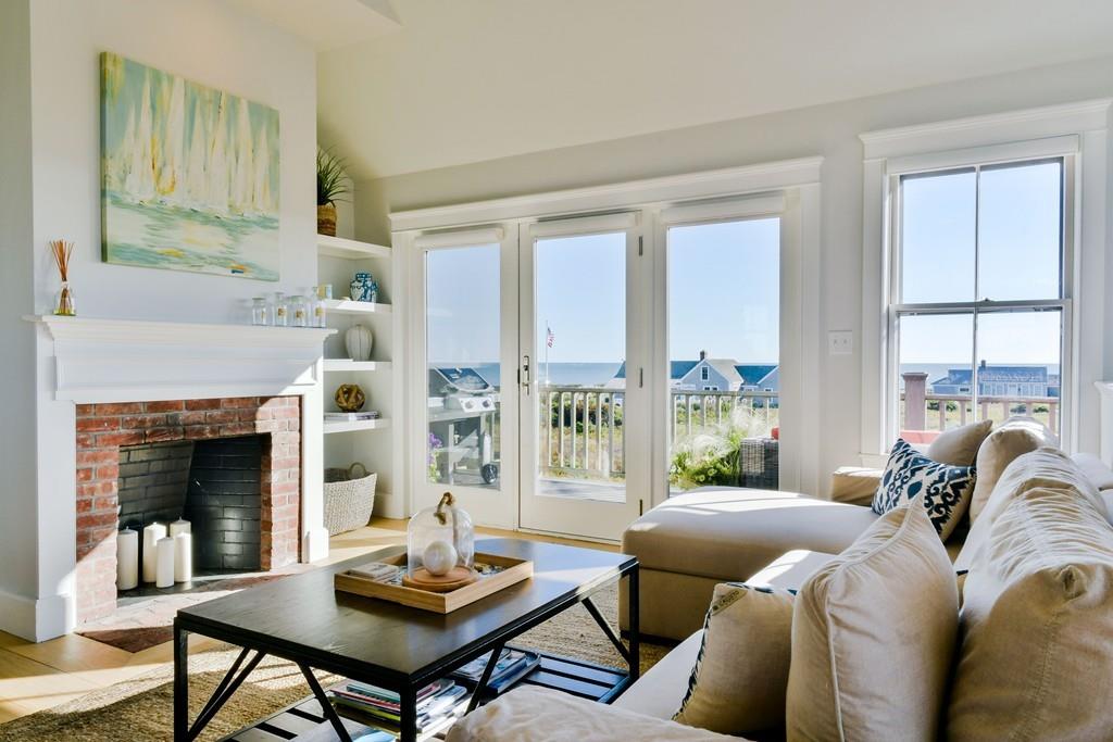51 Madequecham Valley Road Nantucket, MA 02554 - Photo 12 of 25 a living room with furniture and a fireplace