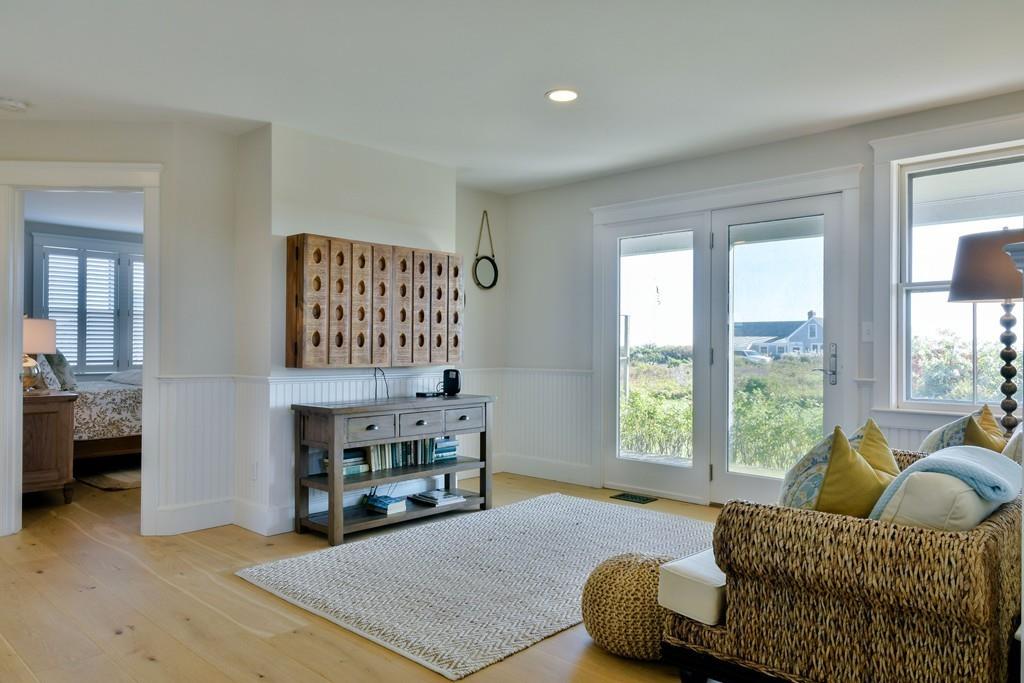 51 Madequecham Valley Road Nantucket, MA 02554 - Photo 13 of 25 a living room with furniture and a large window