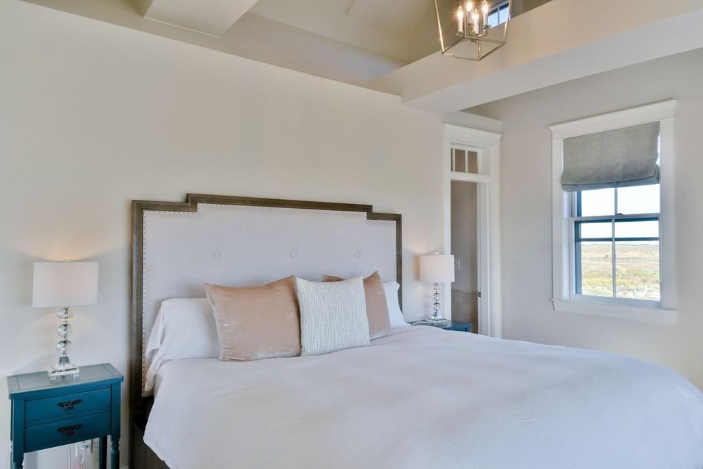 51 Madequecham Valley Road Nantucket, MA 02554 - Photo 14 of 25 a bedroom with a bed and a window