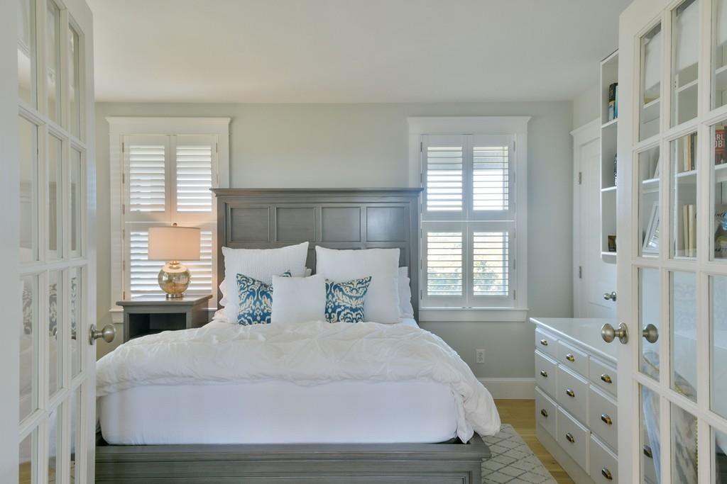 51 Madequecham Valley Road Nantucket, MA 02554 - Photo 15 of 25 a large white bed in a white room