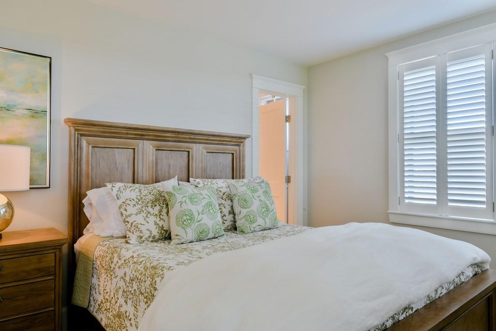 51 Madequecham Valley Road Nantucket, MA 02554 - Photo 17 of 25 a bedroom with a bed and a window