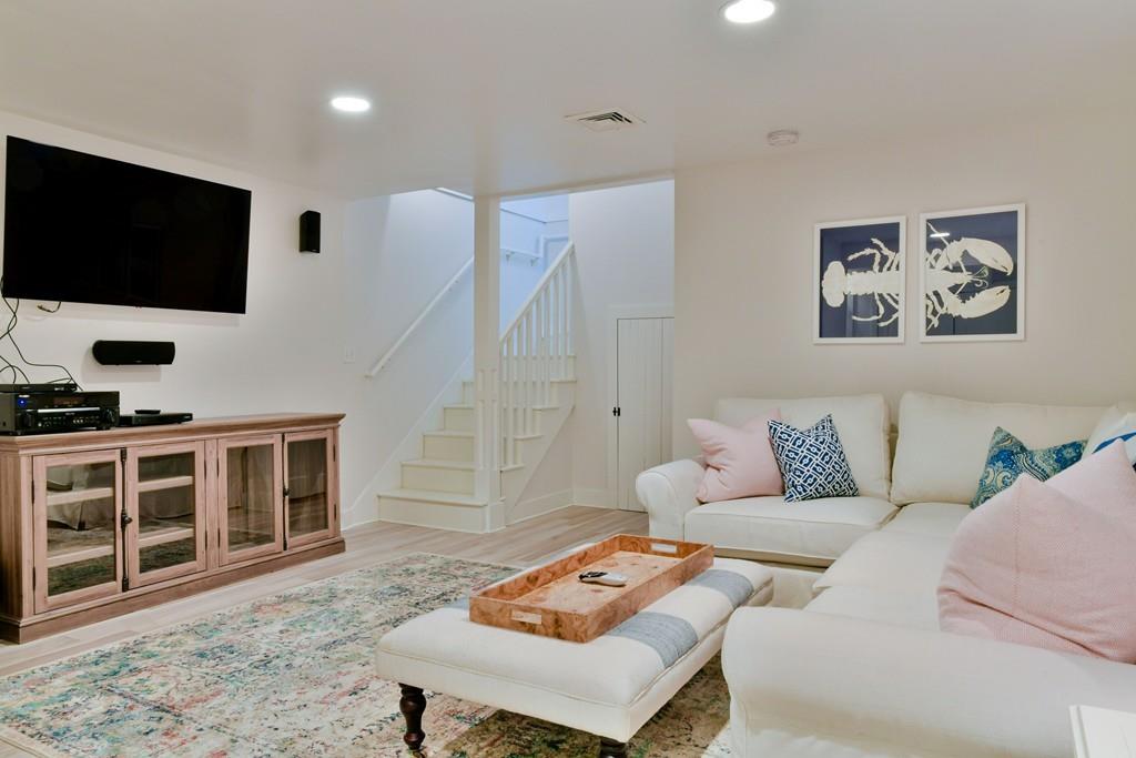 51 Madequecham Valley Road Nantucket, MA 02554 - Photo 22 of 25 a living room with furniture and a flat screen tv