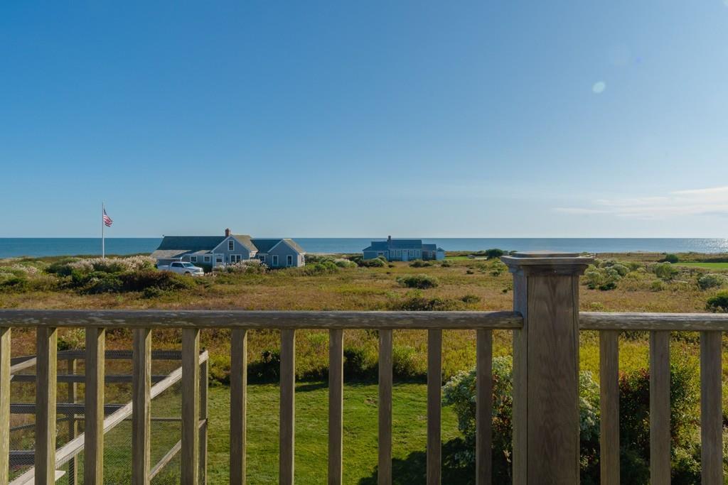 51 Madequecham Valley Road Nantucket, MA 02554 - Photo 24 of 25 a view of a balcony with an outdoor space