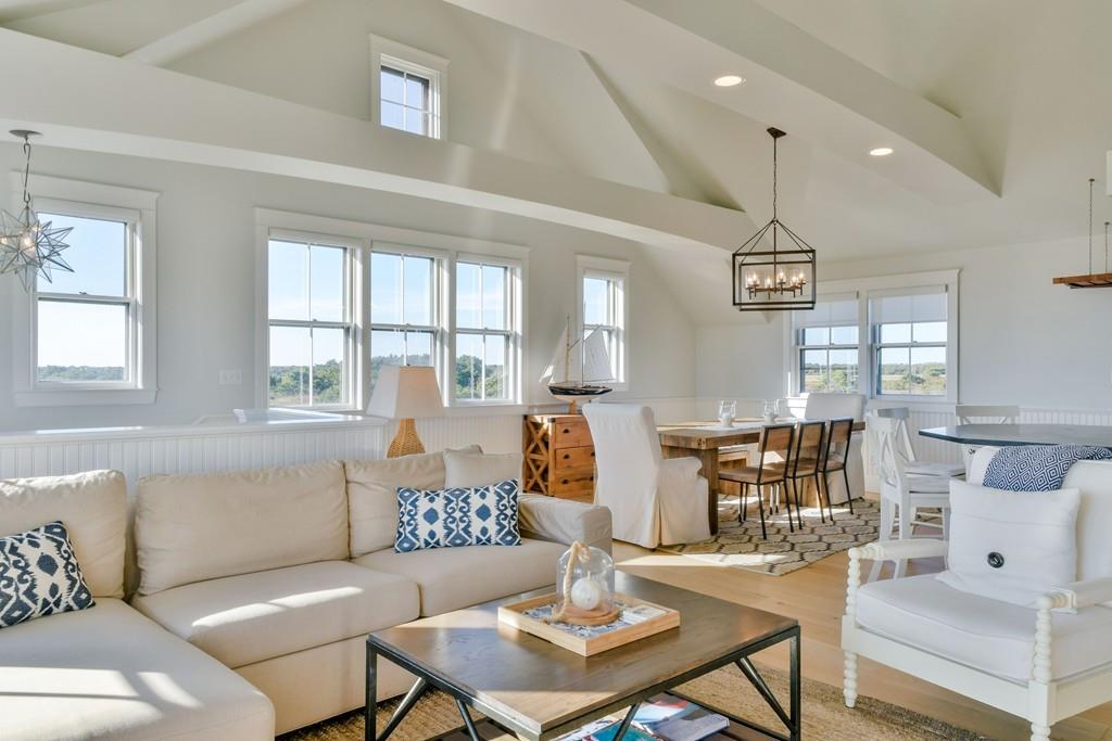 51 Madequecham Valley Road Nantucket, MA 02554 - Photo 4 of 25 a living room with furniture and a large window