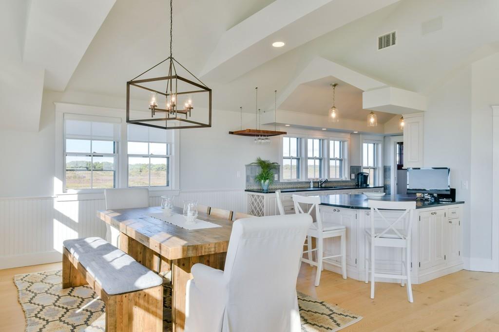 51 Madequecham Valley Road Nantucket, MA 02554 - Photo 8 of 25 a view of a dining room with furniture a chandelier and wooden floor